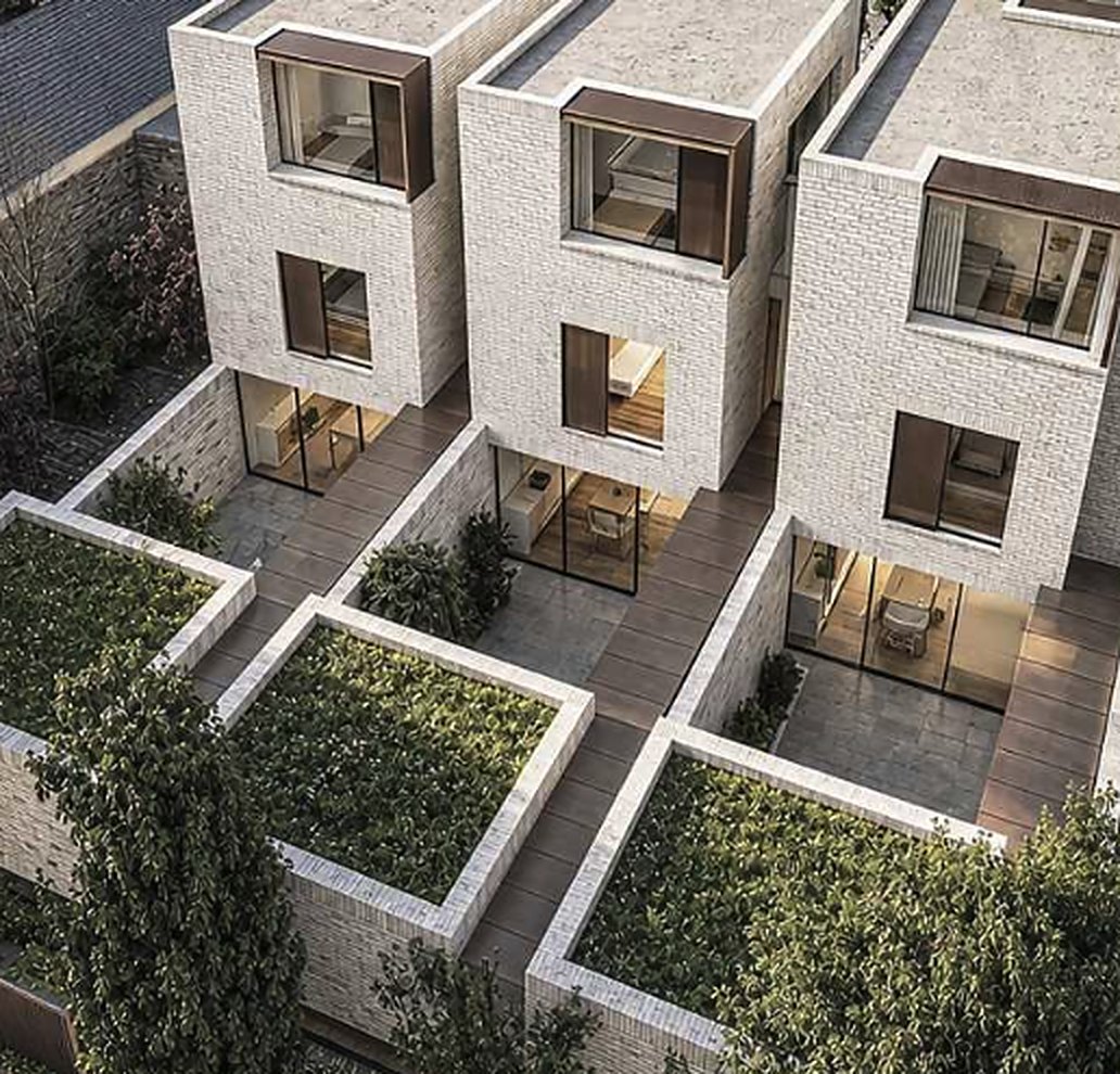 Aerial view of the three brick houses and their courtyard gardens at 53 Belsize Square